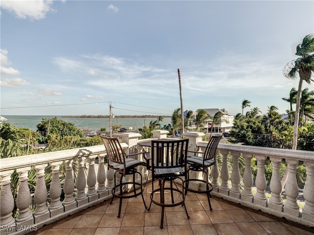 balcony featuring a water view