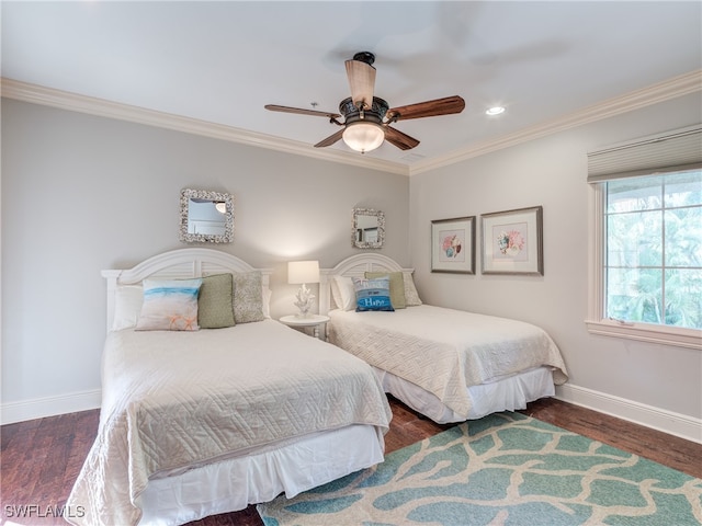 bedroom with dark wood-type flooring, ceiling fan, and crown molding