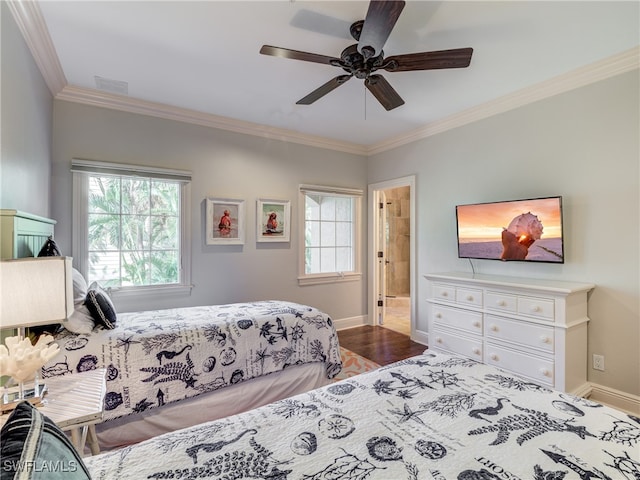 bedroom with connected bathroom, hardwood / wood-style floors, crown molding, and ceiling fan