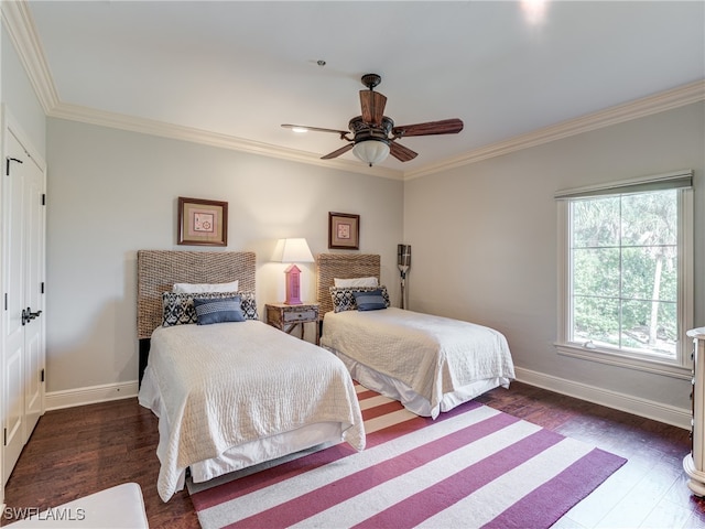 bedroom with crown molding, dark wood-type flooring, and ceiling fan