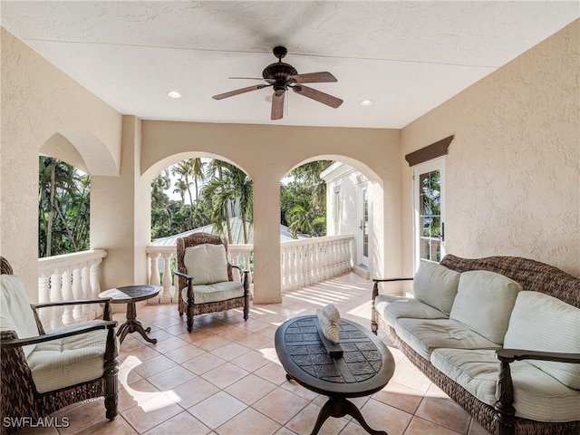 view of patio featuring an outdoor living space and ceiling fan