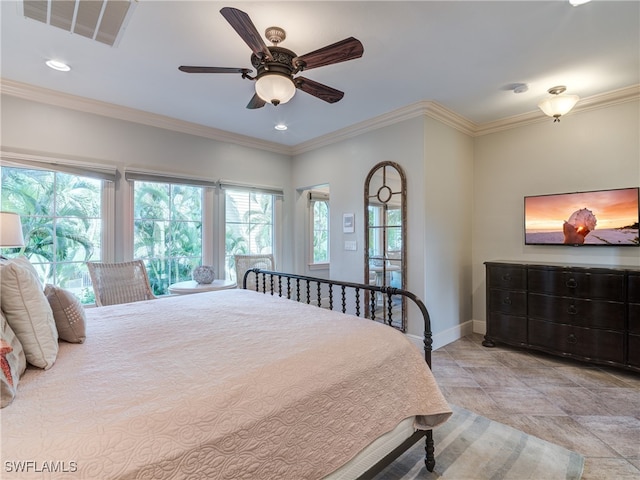 bedroom with ceiling fan and crown molding