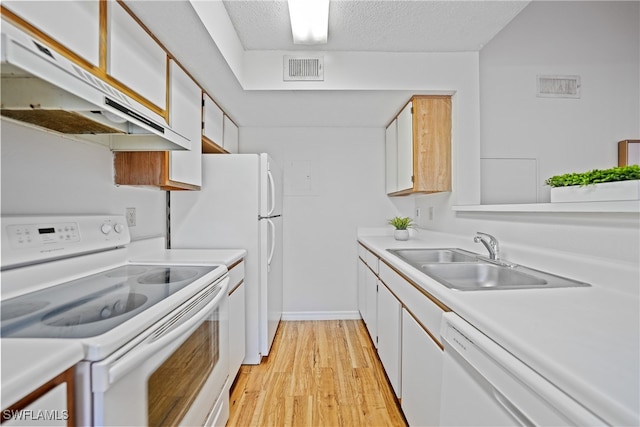 kitchen with white cabinets, sink, white appliances, a textured ceiling, and light hardwood / wood-style floors