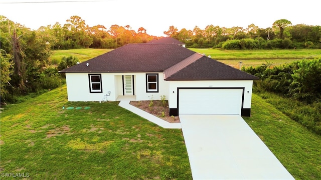 ranch-style house with a garage and a front yard