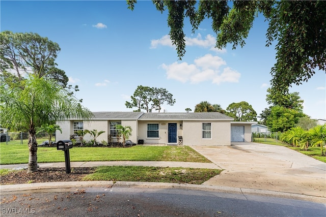 ranch-style home featuring a front yard