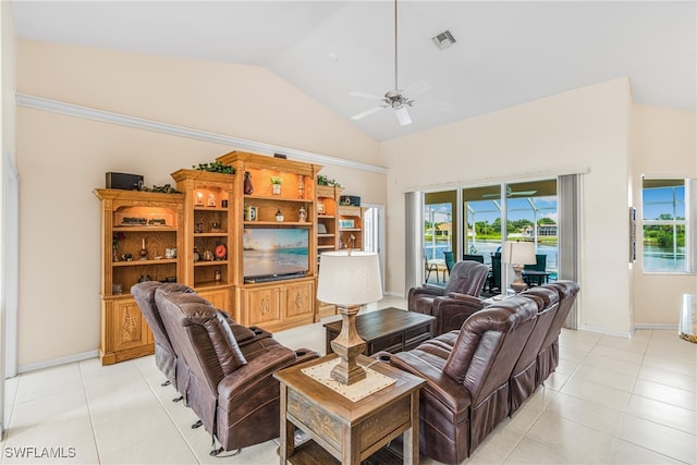 tiled living room with high vaulted ceiling and ceiling fan