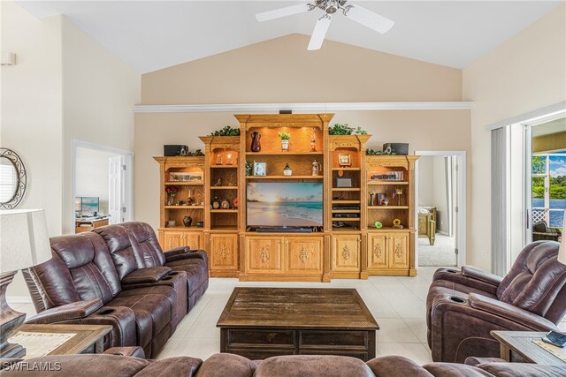 tiled living room with ceiling fan and high vaulted ceiling