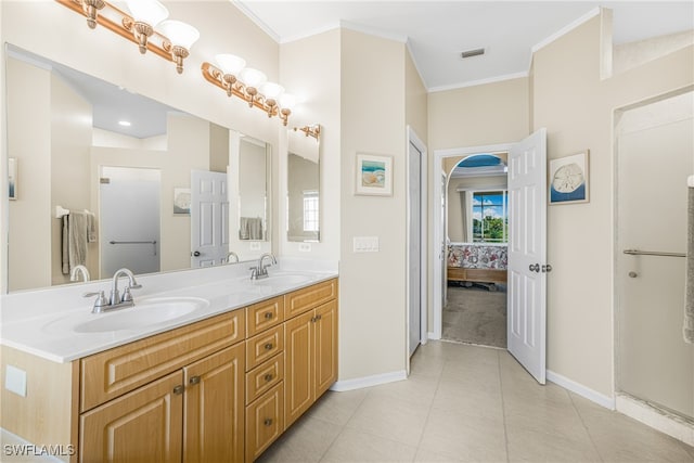 bathroom featuring ornamental molding, tile patterned floors, and vanity