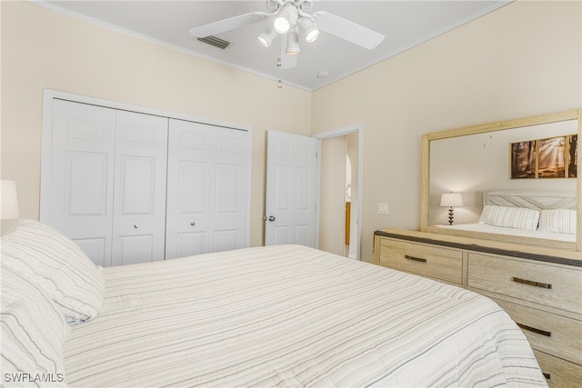 bedroom featuring ceiling fan and a closet