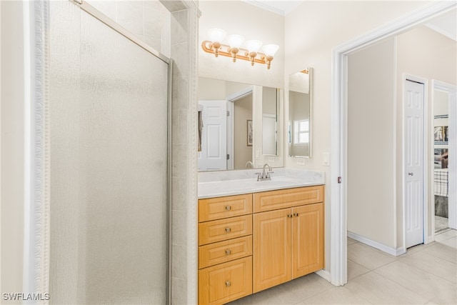 bathroom featuring vanity, a shower with shower door, and tile patterned floors