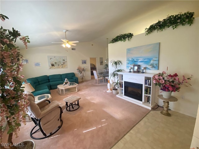 living room with carpet, lofted ceiling, and ceiling fan