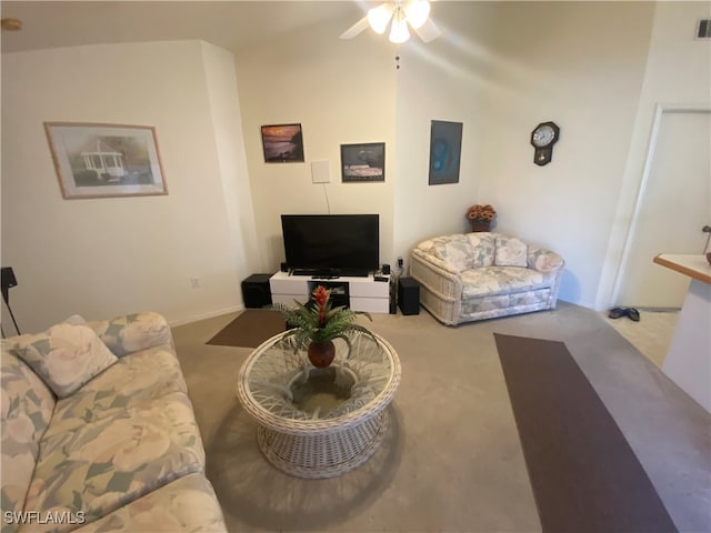 carpeted living room featuring lofted ceiling and ceiling fan