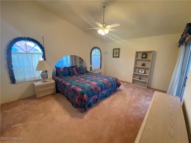 bedroom with lofted ceiling, carpet, and ceiling fan