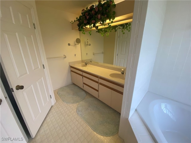 bathroom with tiled tub and vanity