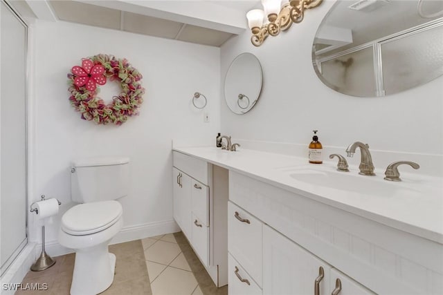 bathroom with toilet, a shower with door, tile patterned floors, and vanity