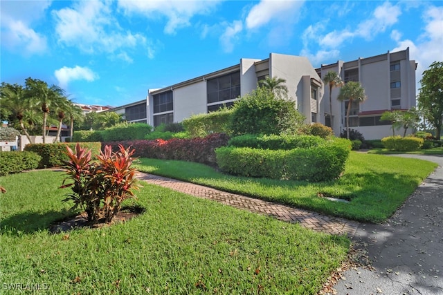 exterior space featuring a front lawn