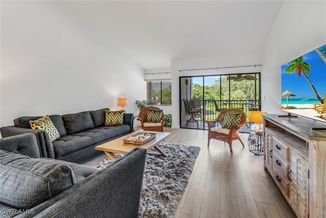 4600 Flagship Dr Unit 201, Fort Myers, FL 33919 - living room featuring vaulted ceiling and wood finished floors