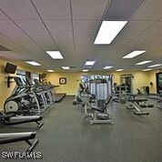 gym with a paneled ceiling