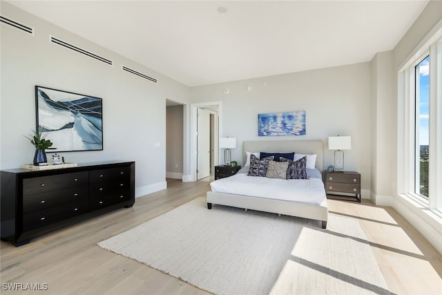 bedroom with light hardwood / wood-style flooring