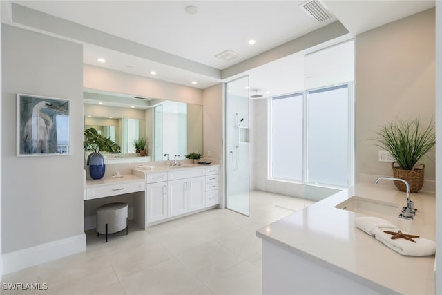 bathroom with vanity, a shower, and tile patterned flooring