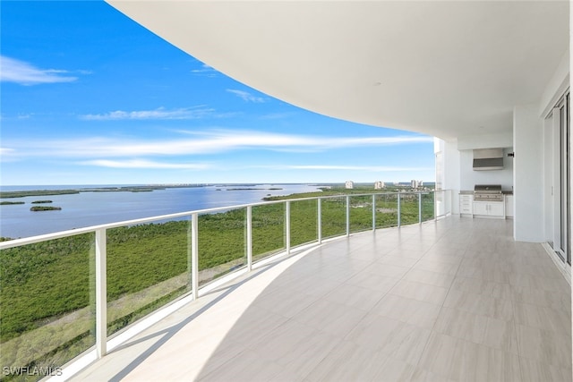 balcony featuring a water view