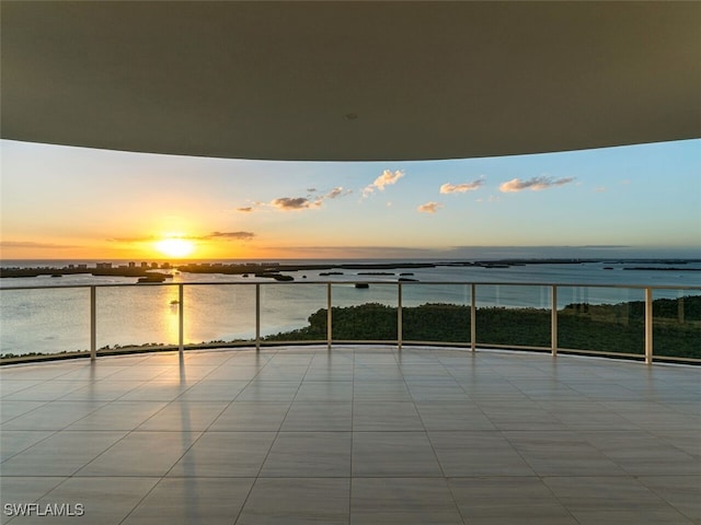 balcony at dusk with a water view