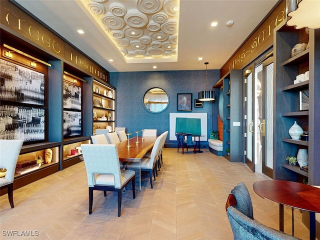 dining space featuring a tray ceiling