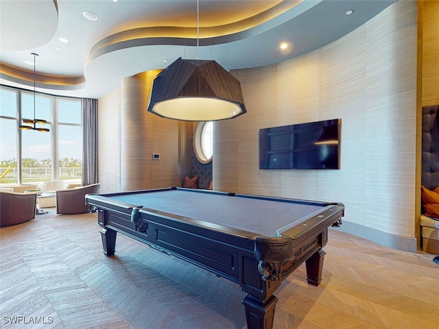 recreation room featuring billiards and a tray ceiling