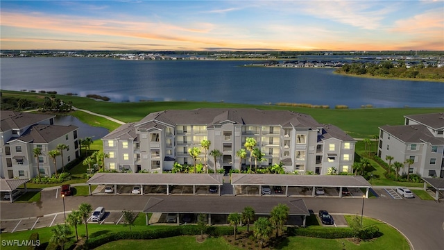 aerial view at dusk with a water view