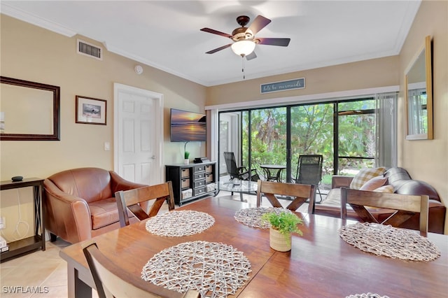 dining space featuring ceiling fan and ornamental molding