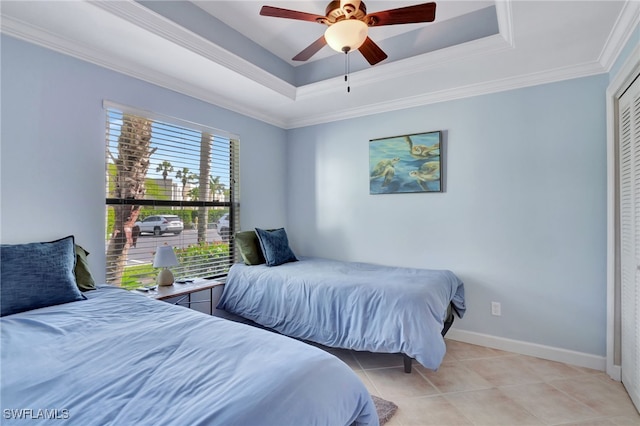 3323 Olympic Dr Unit 715, Naples, FL 34105 - bedroom with a raised ceiling, light tile patterned floors, ornamental molding, baseboards, and a ceiling fan