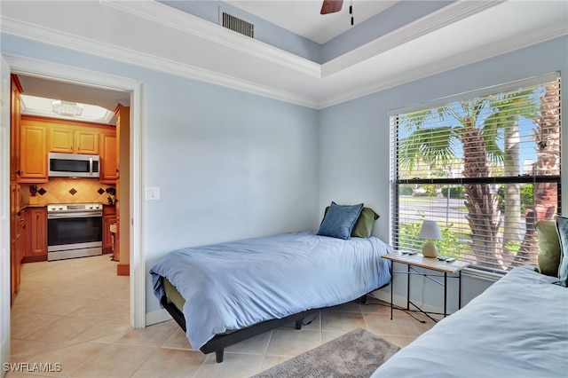 3323 Olympic Dr Unit 715, Naples, FL 34105 - bedroom featuring light tile patterned floors, ornamental molding, ceiling fan, and a raised ceiling