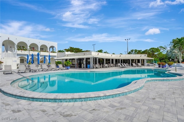 view of swimming pool with a patio