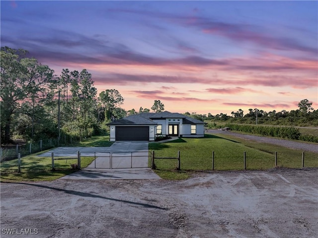 7969 19th Ter, Labelle, FL 33935 - view of front facade featuring a fenced front yard, a gate, driveway, a front yard, and an attached garage