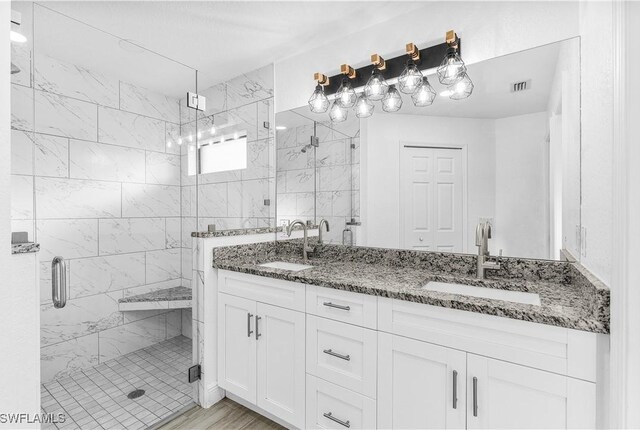 7969 19th Ter, Labelle, FL 33935 - bathroom with a stall shower, double vanity, a sink, and visible vents