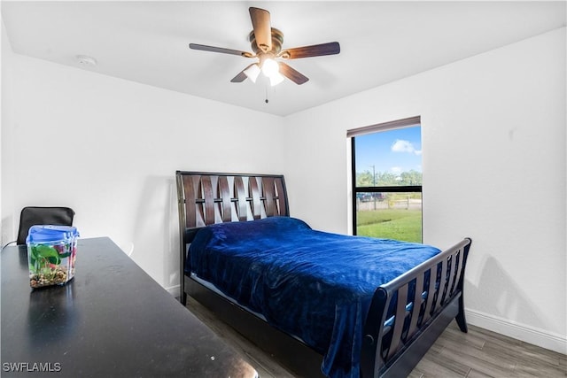 7969 19th Ter, Labelle, FL 33935 - bedroom featuring wood finished floors, ceiling fan, and baseboards