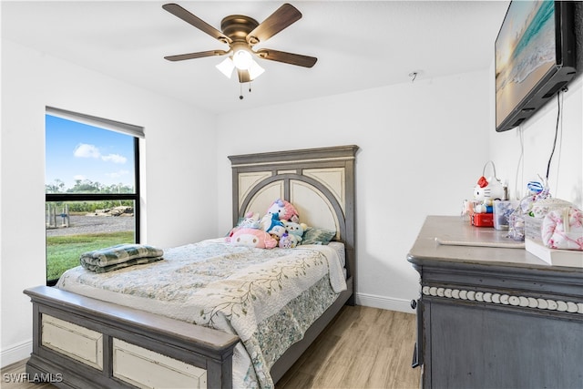 bedroom featuring ceiling fan and light hardwood / wood-style floors