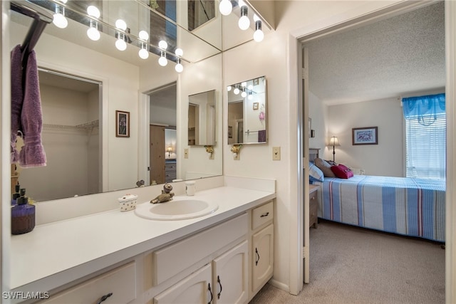 bathroom featuring vanity and a textured ceiling