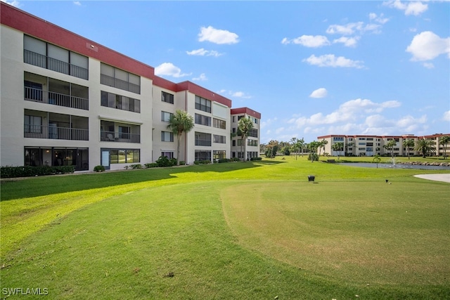 view of home's community featuring a lawn