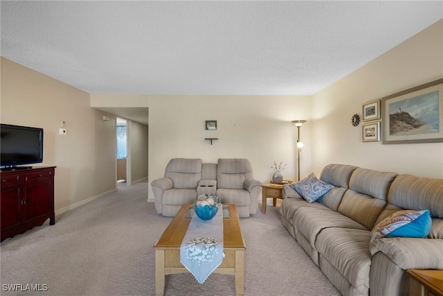 carpeted living room with a textured ceiling