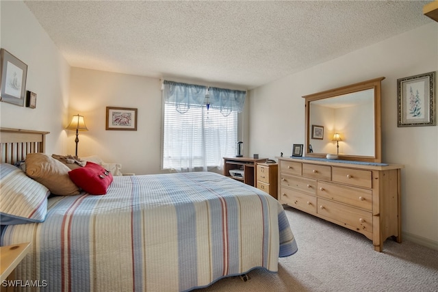 carpeted bedroom with a textured ceiling