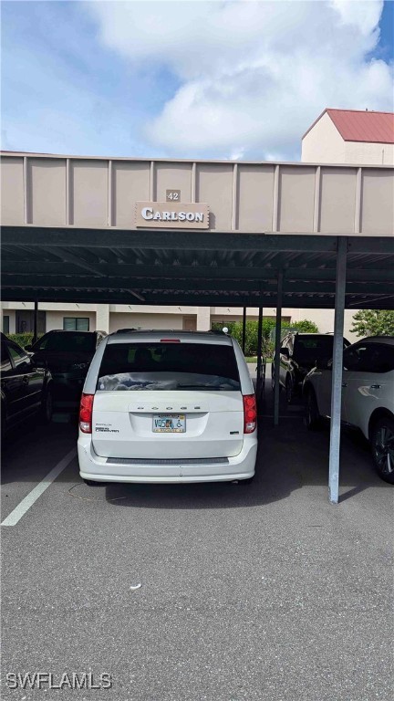 view of vehicle parking featuring a carport