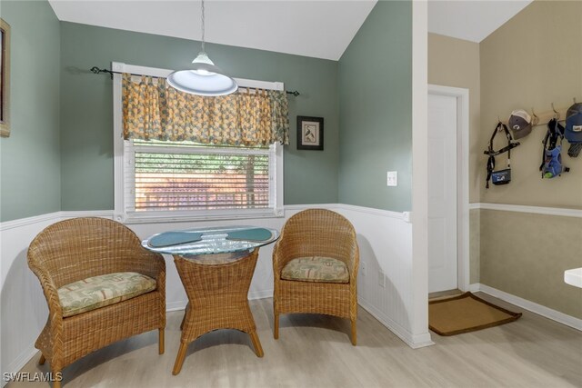 sitting room with light hardwood / wood-style floors and lofted ceiling