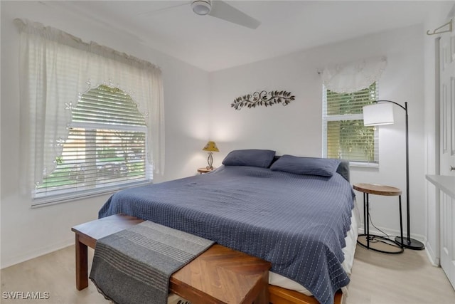 bedroom featuring light wood-type flooring and ceiling fan