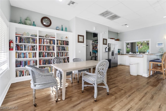 dining area with light hardwood / wood-style flooring