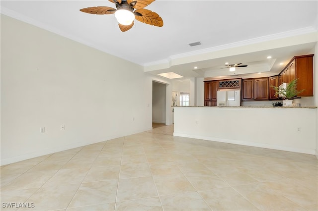 unfurnished living room with ceiling fan, crown molding, and light tile patterned floors