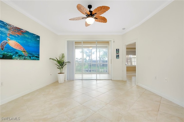 unfurnished room with ornamental molding, ceiling fan, and light tile patterned floors