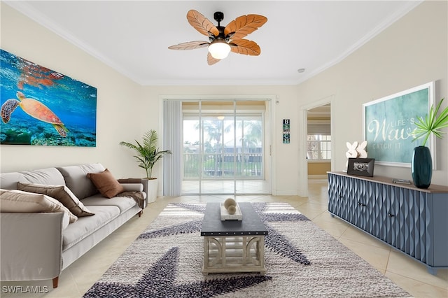 living room with light tile patterned flooring, ceiling fan, and ornamental molding