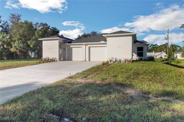 view of side of property with a yard and a garage