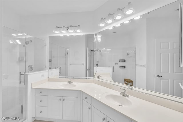 bathroom with vanity and walk in shower